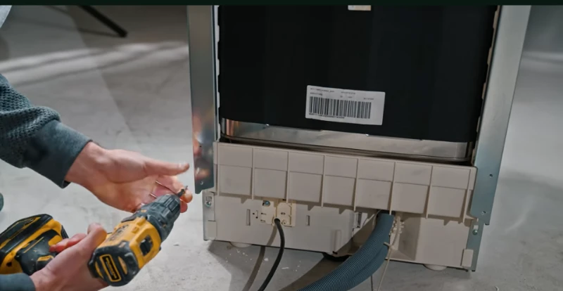 Technician repairing a dishwasher during an appliance repair service call in Abilene, TX